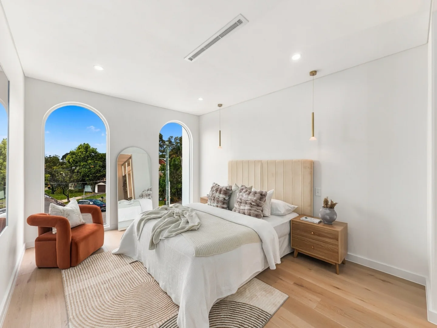The professionally edited photograph from the same five-exposure bedroom capture